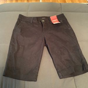 Black Bermuda shorts.